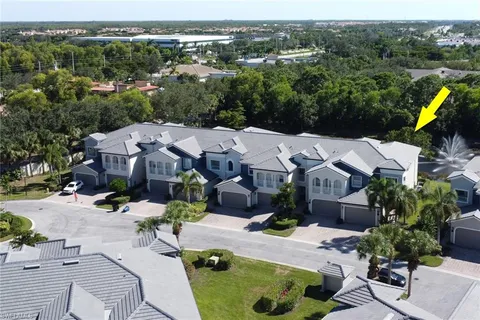 an aerial view of a house with garden space and street view