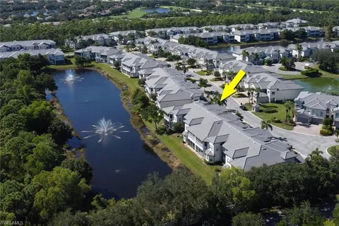 an aerial view of a house with a swimming pool yard and outdoor seating