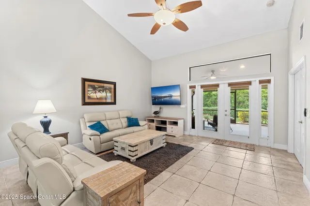 a work room with furniture and a ceiling fan