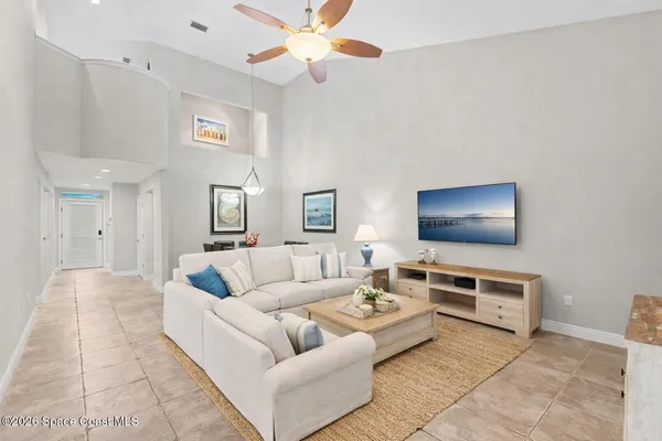 a bedroom with two beds and a window