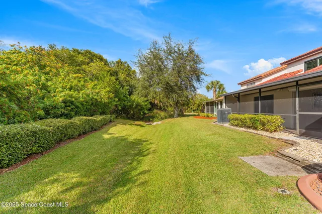 a bathroom with a double vanity sink mirror and bathtub