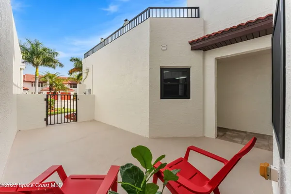 a view of a hallway with closet and bathroom