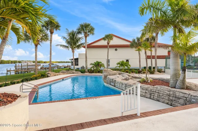 a view of a swimming pool with a patio
