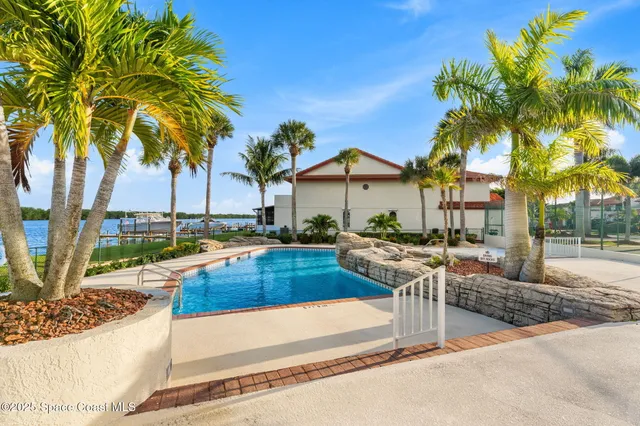 a kitchen with stainless steel appliances granite countertop a sink and a refrigerator