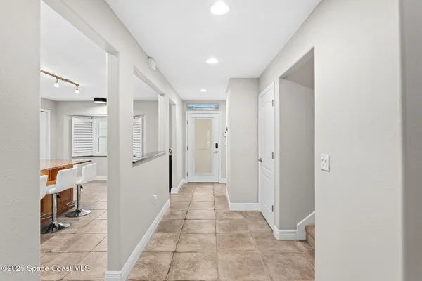 a dining room with a table and chairs