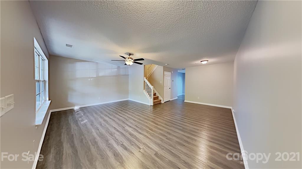 8250 Rudolph Road Charlotte, NC 28216 - Photo 3 of 13 a view of empty room with wooden floor