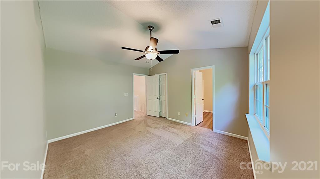8250 Rudolph Road Charlotte, NC 28216 - Photo 8 of 13 a view of room with a ceiling fan