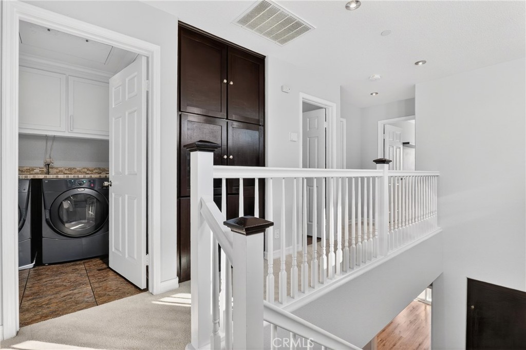 4 Palladium Lane Ladera Ranch, CA 92694 - Photo 29 of 38 a view of a hallway with washer and dryer