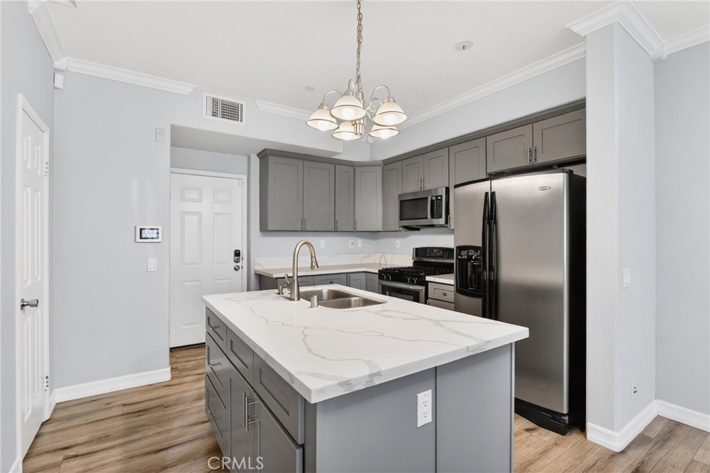 4 Palladium Lane Ladera Ranch, CA 92694 - Photo 7 of 38 a kitchen with stainless steel appliances granite countertop a sink a refrigerator and a stove