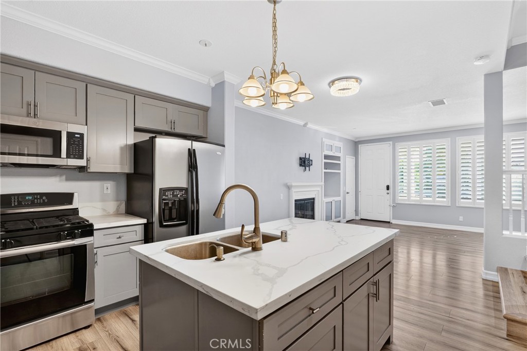 4 Palladium Lane Ladera Ranch, CA 92694 - Photo 8 of 38 a view of kitchen with sink microwave and refrigerator