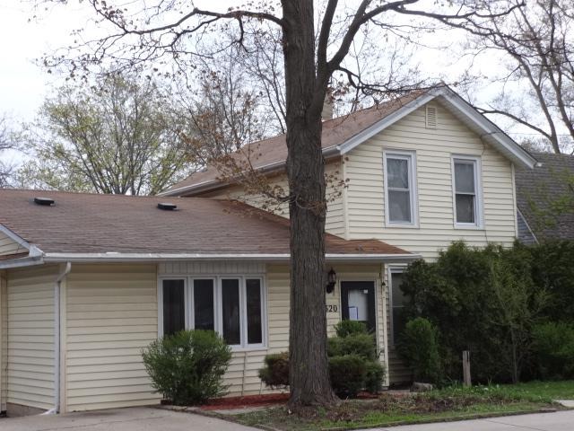 520 Villa Street Elgin, IL 60120 - Photo 1 of 16 a front view of a house with garden