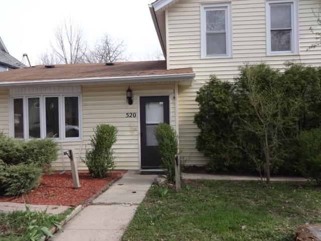 520 Villa Street Elgin, IL 60120 - Photo 2 of 16 a front view of a house with garden