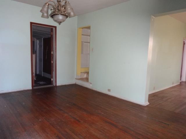 520 Villa Street Elgin, IL 60120 - Photo 4 of 16 a view of an empty room with wooden floor