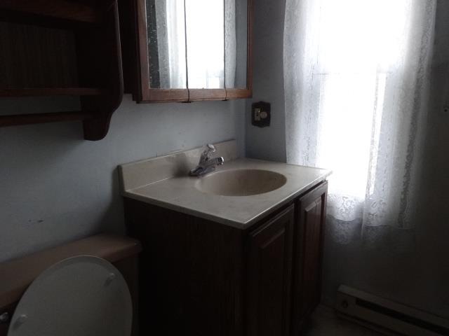 520 Villa Street Elgin, IL 60120 - Photo 7 of 16 a bathroom with a sink and a vanity