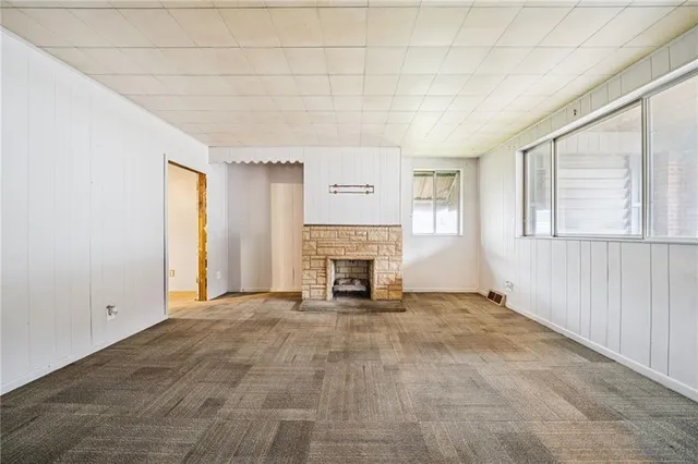 a view of an empty room and a window