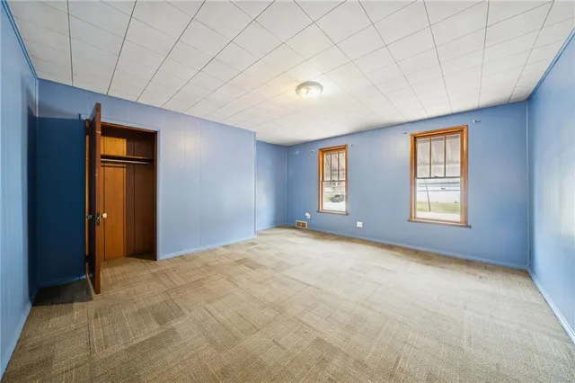 a view of an empty room and window