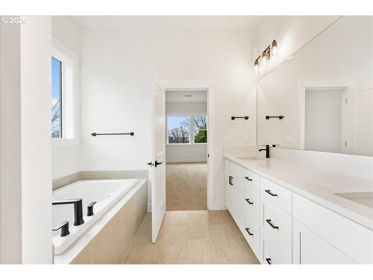737 Southeast Forest Glen Road Estacada, OR 97023 - Photo 21 of 47 a bathroom with a tub sink and mirror