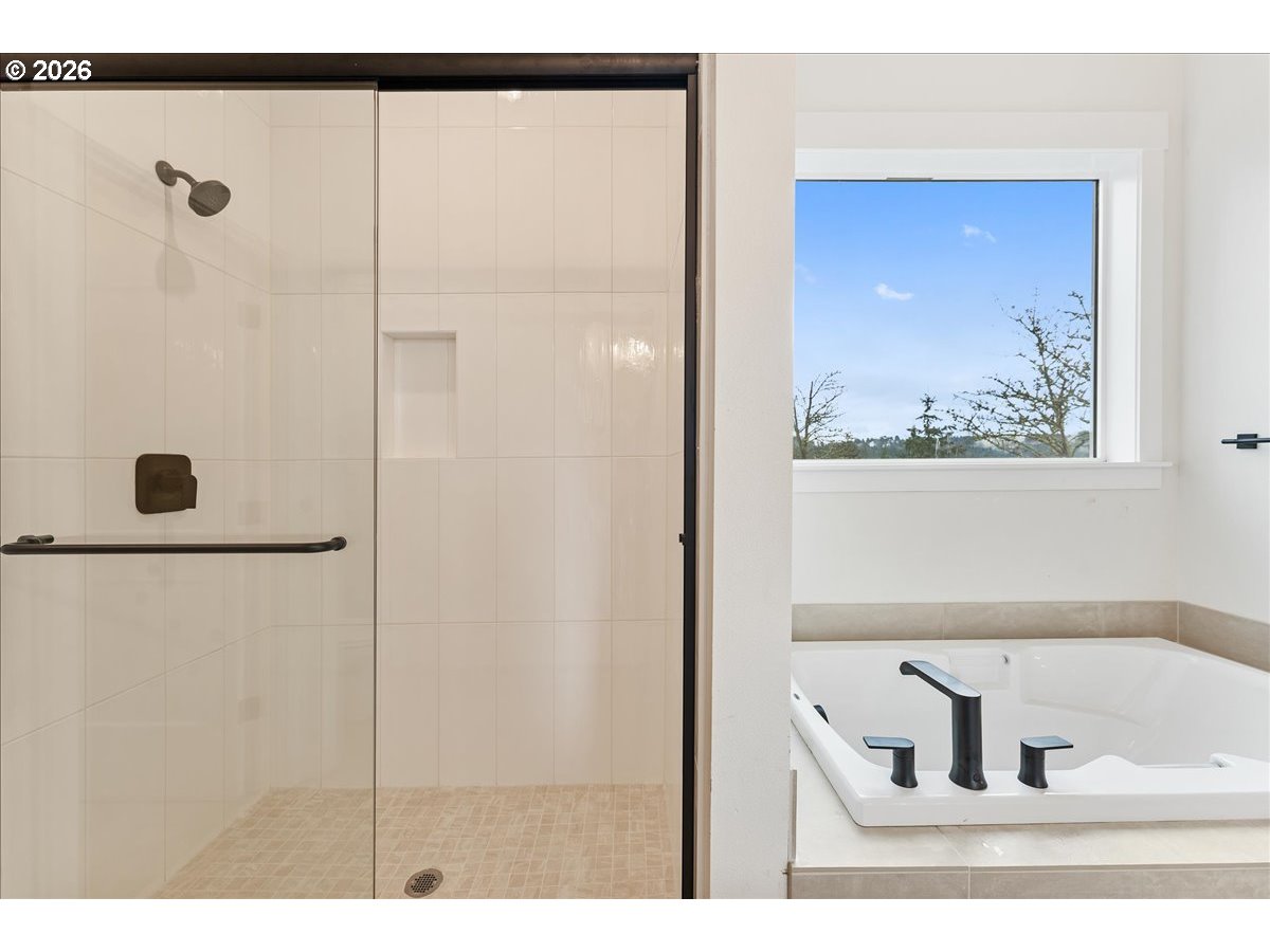 737 Southeast Forest Glen Road Estacada, OR 97023 - Photo 24 of 47 a bathroom with a tub and a shower