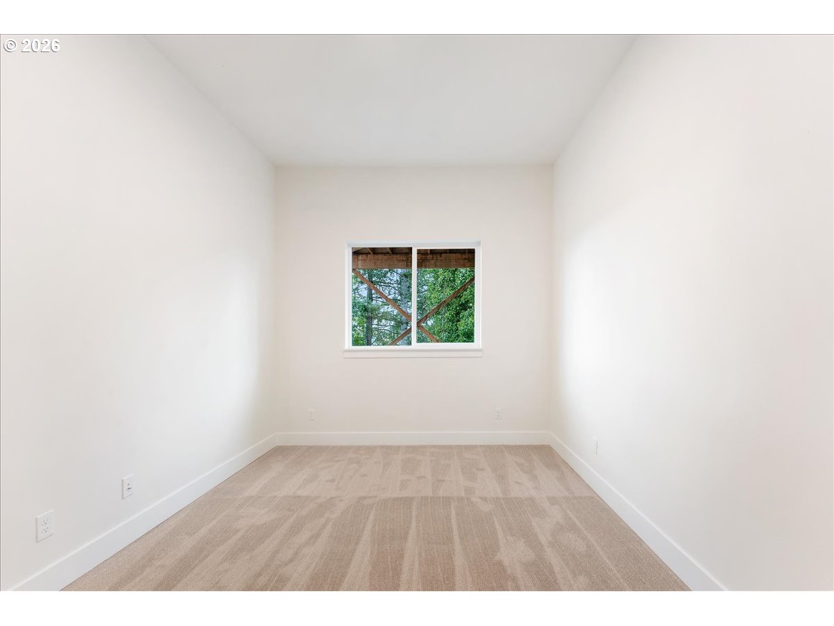 737 Southeast Forest Glen Road Estacada, OR 97023 - Photo 28 of 47 a view of an empty room with a window