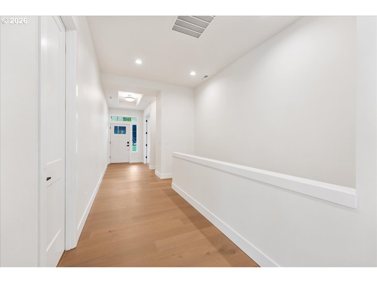 737 Southeast Forest Glen Road Estacada, OR 97023 - Photo 31 of 47 a view of a hallway with wooden floor
