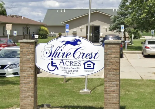 a sign that is on the side of the building