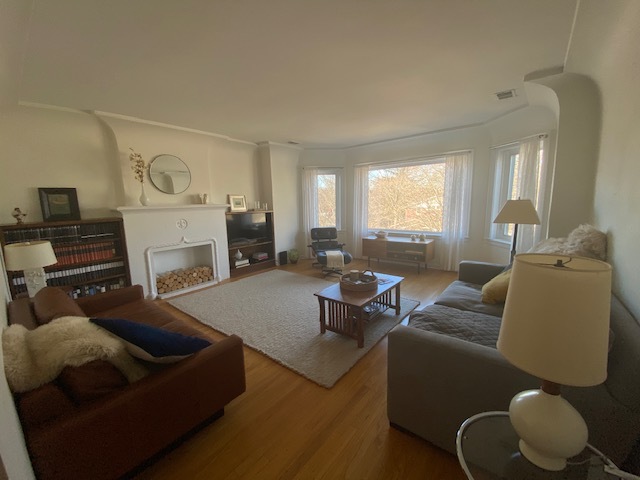 1918 Colfax Street, Unit 3 Evanston, IL 60201 - Photo 2 of 5 a living room with furniture and a fireplace