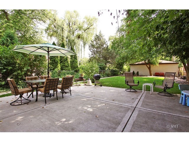 1918 Colfax Street, Unit 3 Evanston, IL 60201 - Photo 5 of 5 a view of a backyard with furniture and a garden