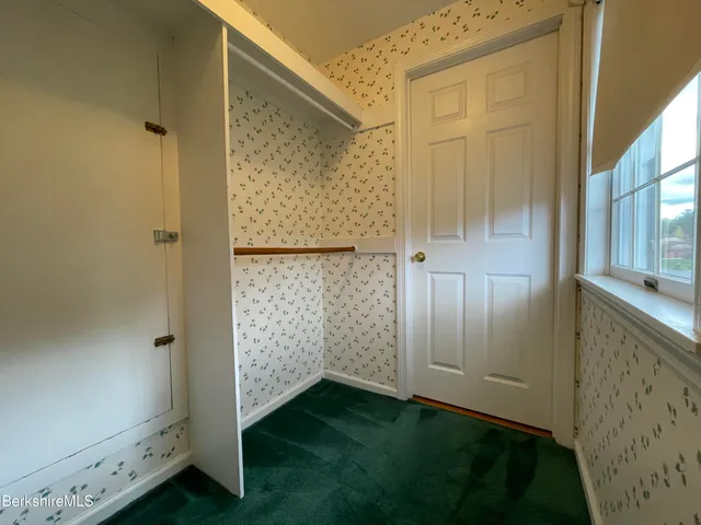a bathroom with a shower and a mirror