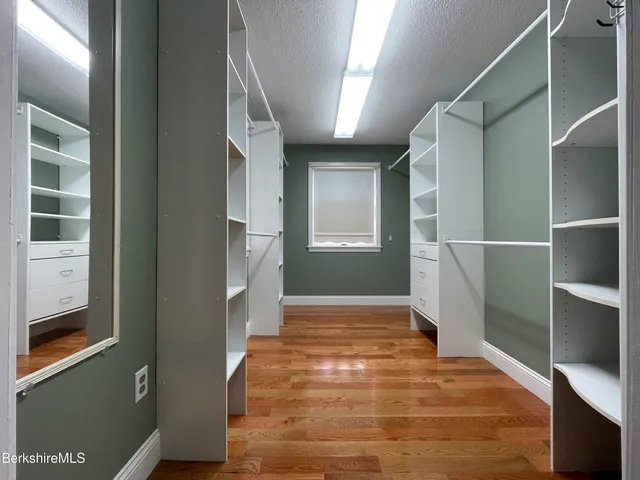 a bathroom with a sink toilet and window