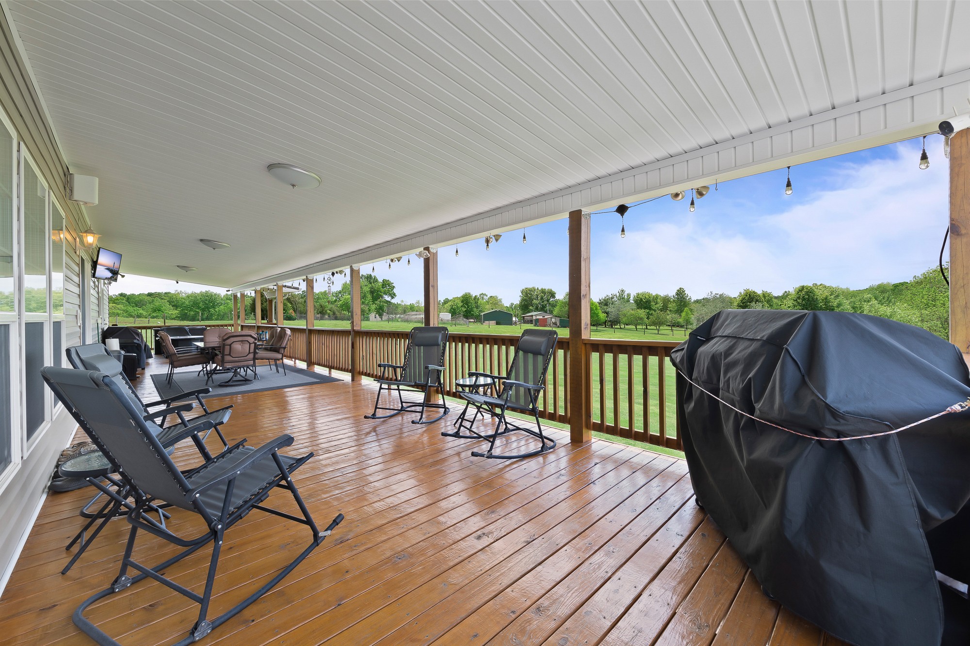 103 Molten Lane Hilham, TN 38568 - Photo 26 of 39 a view of a balcony with chairs and wooden floor