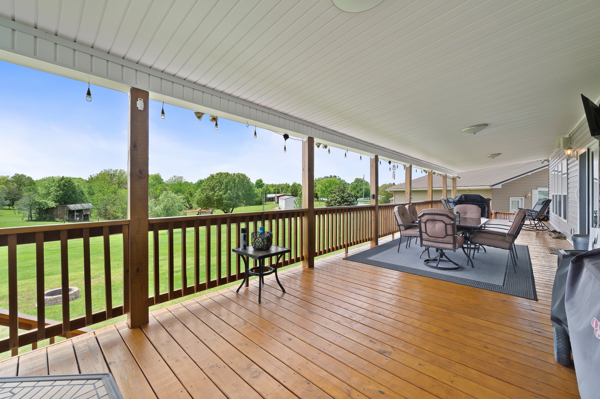 103 Molten Lane Hilham, TN 38568 - Photo 28 of 39 a view of a patio with wooden floor table and chairs