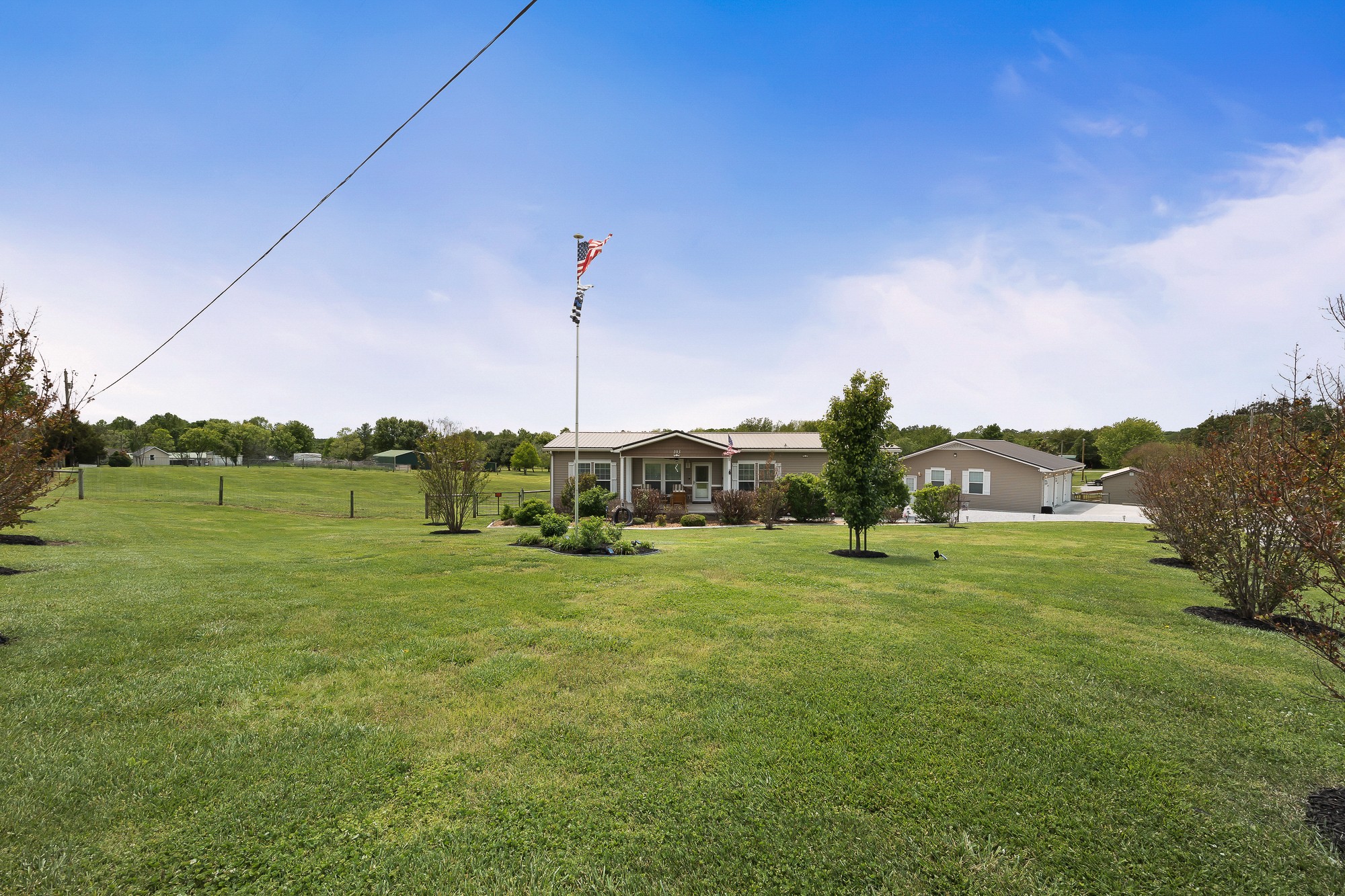 103 Molten Lane Hilham, TN 38568 - Photo 37 of 39 a view of a water pond with green yard