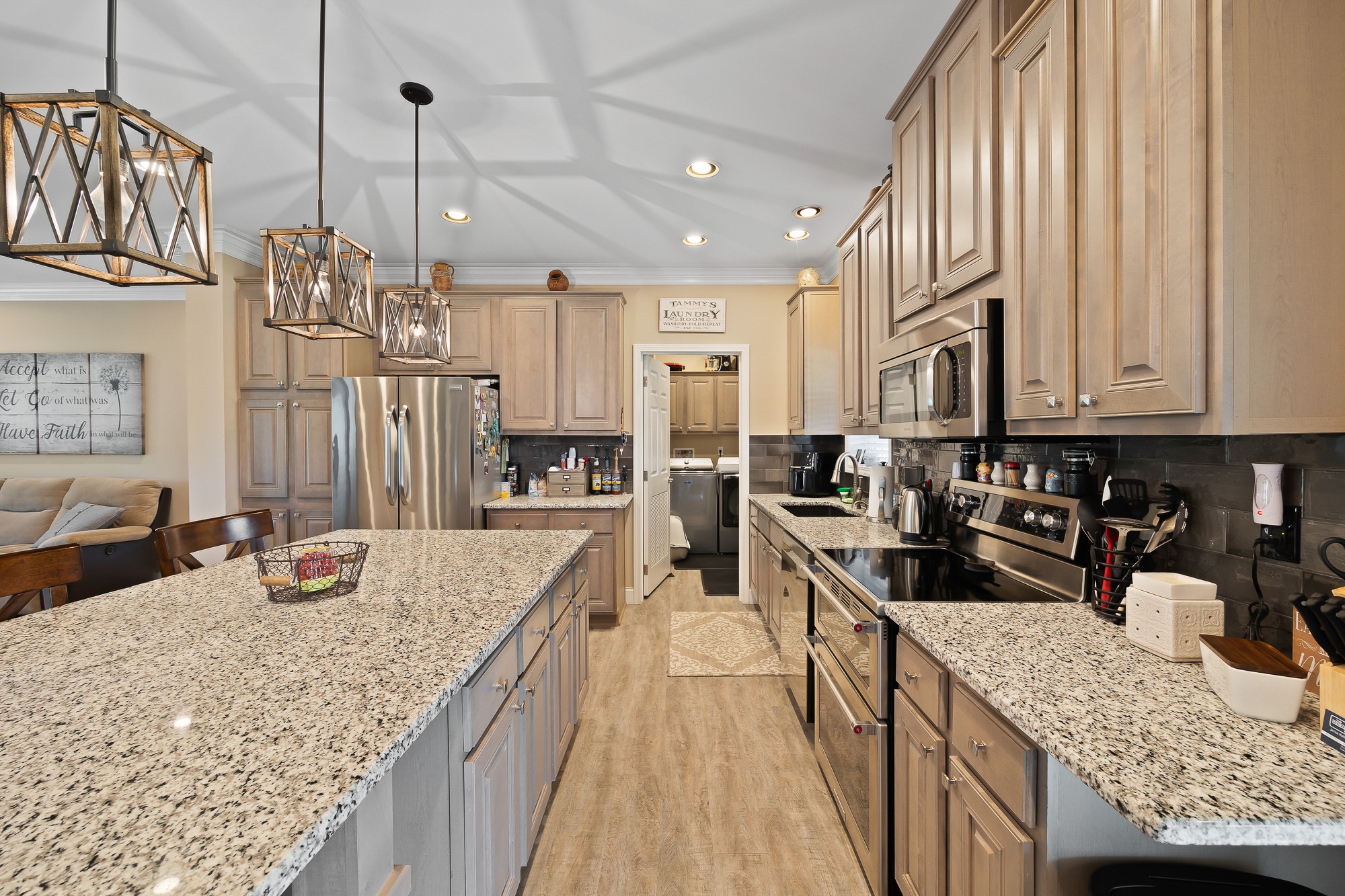 103 Molten Lane Hilham, TN 38568 - Photo 7 of 39 a kitchen with granite countertop a sink stainless steel appliances and lots of counter space