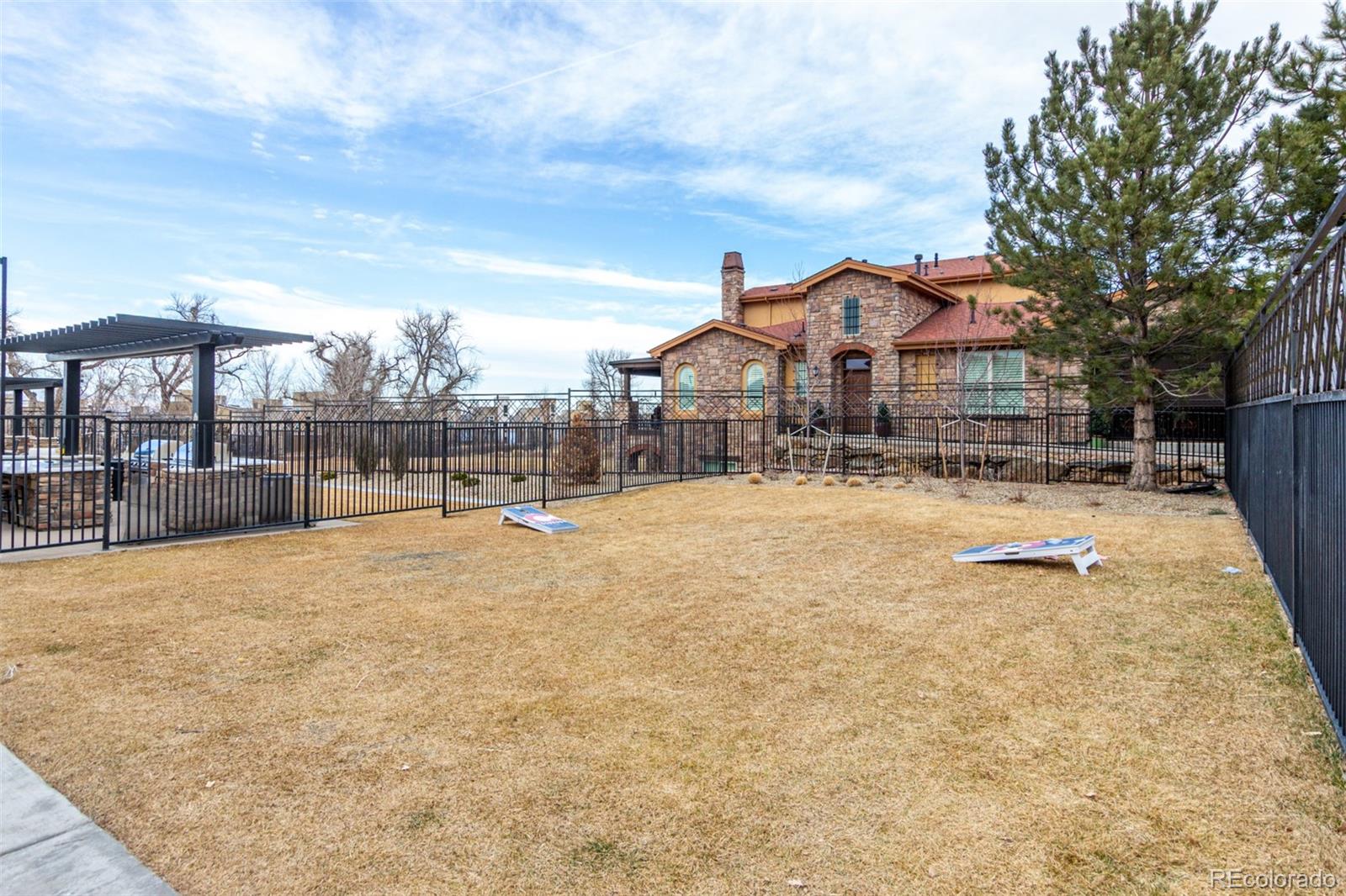 8417 Rizza Street, Unit A Littleton, CO 80129 - Photo 22 of 25 a view of large white house with a yard