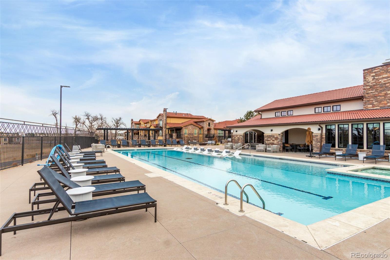 8417 Rizza Street, Unit A Littleton, CO 80129 - Photo 23 of 25 a roof deck with table and chairs