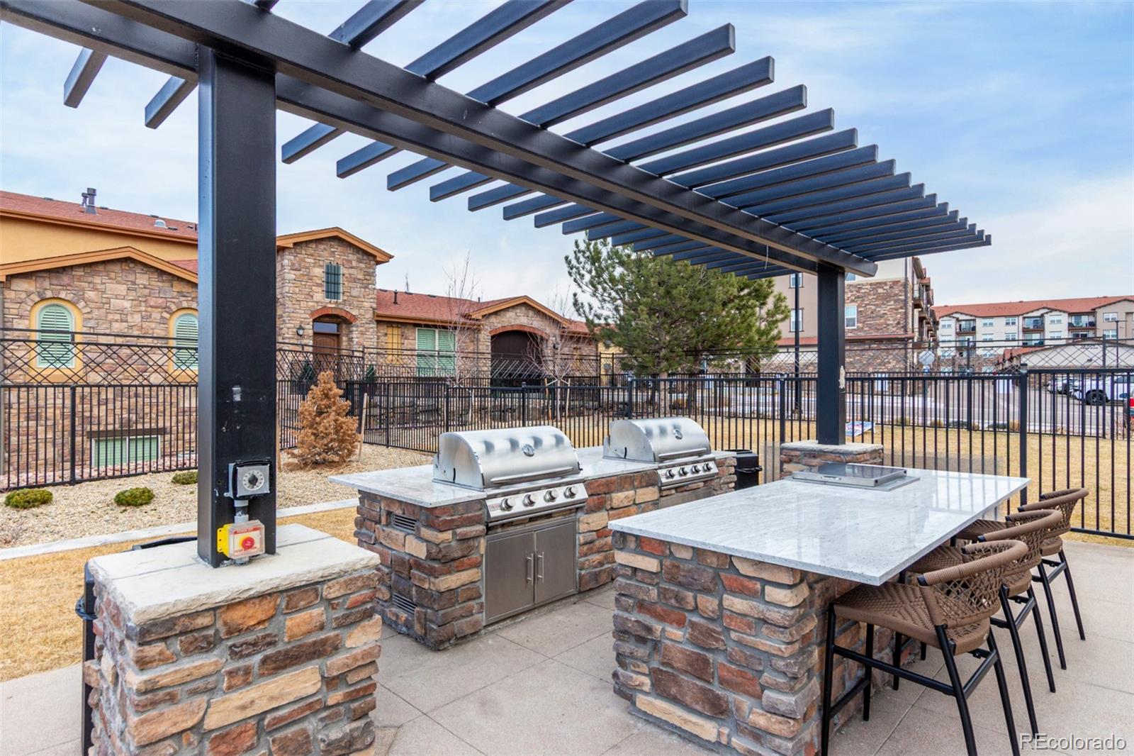 8417 Rizza Street, Unit A Littleton, CO 80129 - Photo 24 of 25 a outdoor view with a sitting space