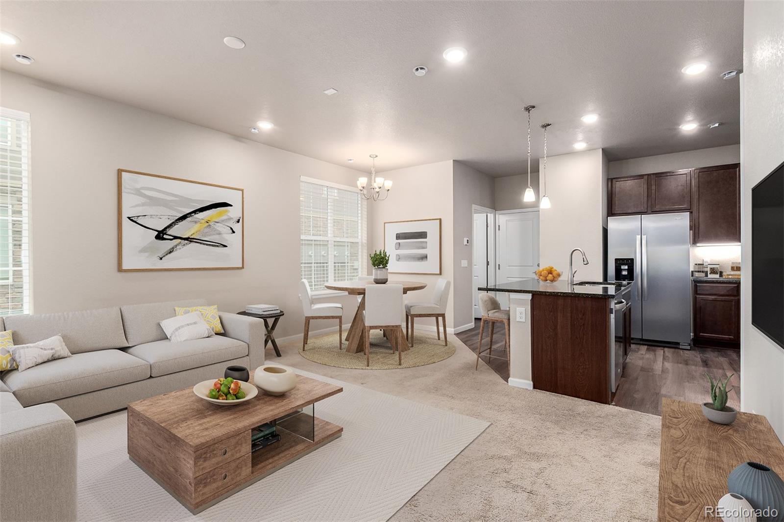 8417 Rizza Street, Unit A Littleton, CO 80129 - Photo 3 of 25 a living room with furniture kitchen view and a refrigerator