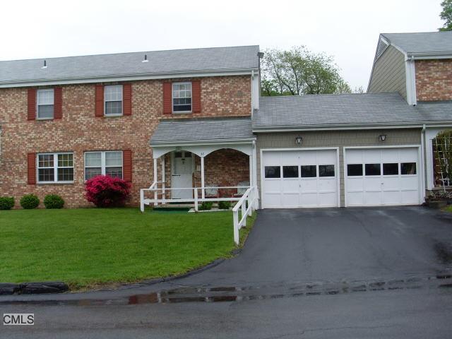 38 West Whisconier Road, Unit 34 Brookfield, CT 06804 - Photo 1 of 1 a front view of a house with a garden