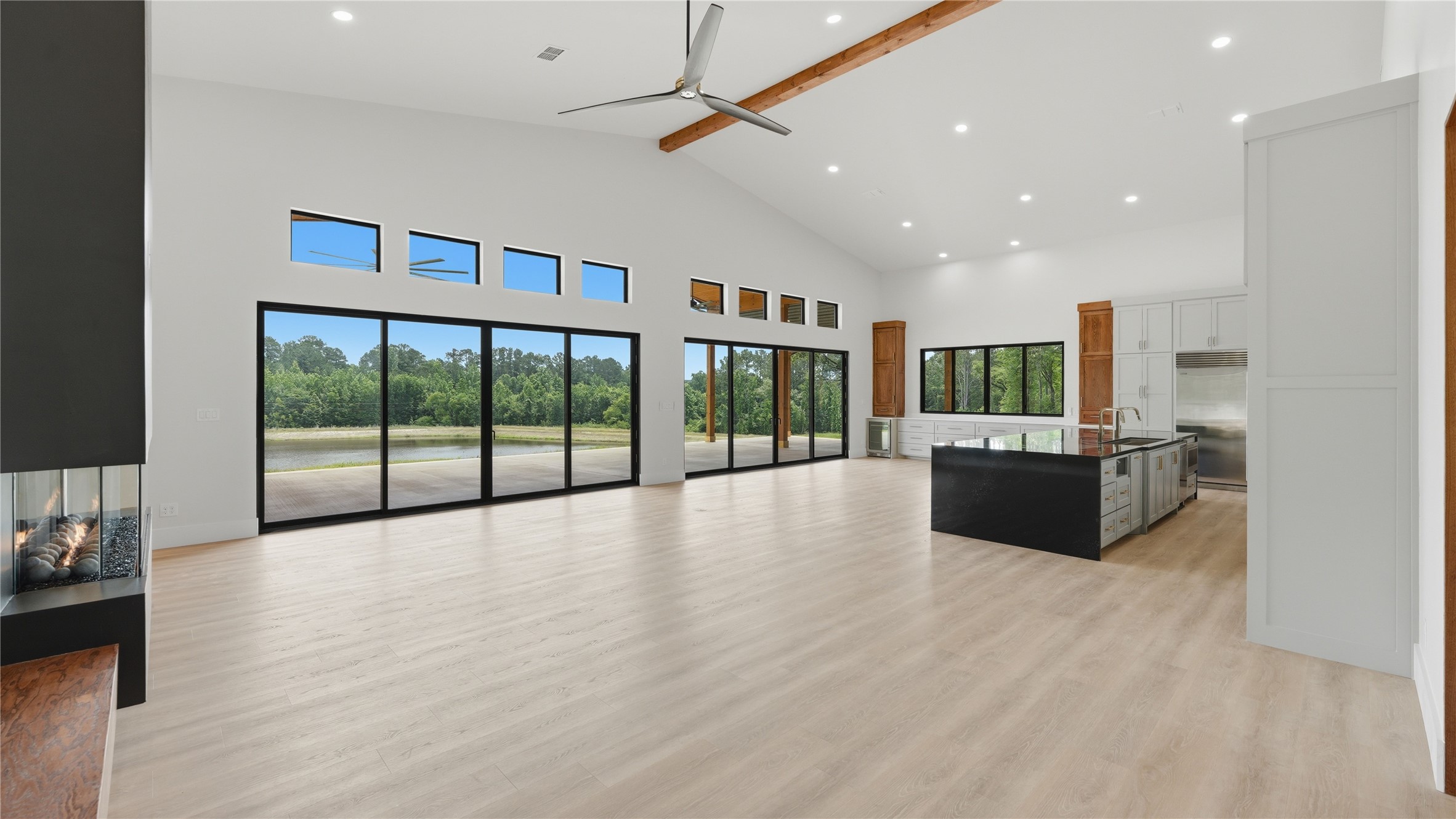 447 County Road 2211 Rusk, TX 75785 - Photo 27 of 50 a large hall with stainless steel appliances kitchen island granite countertop a large window and a couch