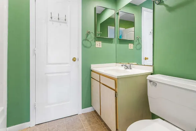 a picture of a bathroom with a sink and a window