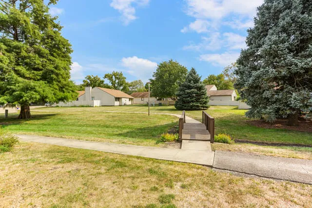 a view of a playground with basketball court