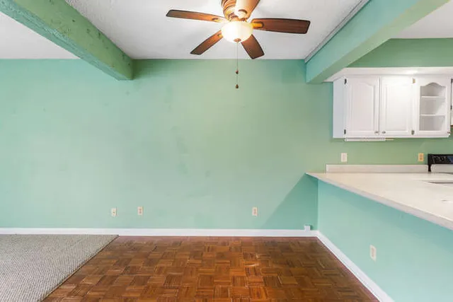 a view of room with window and fan
