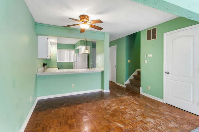 a view of an empty room with a fireplace
