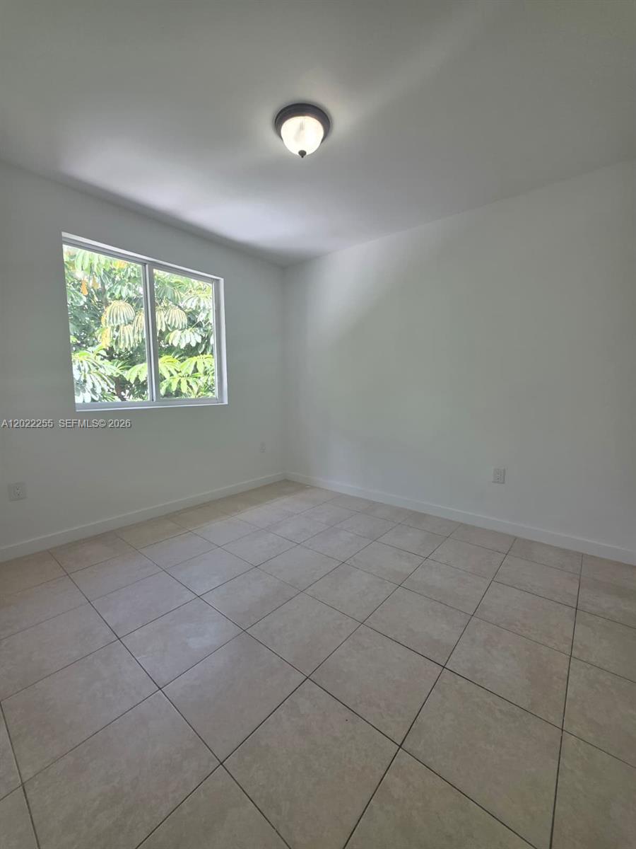 829 Southwest 3rd Street, Unit 831 Miami, FL 33130 - Photo 3 of 21 an empty room with windows