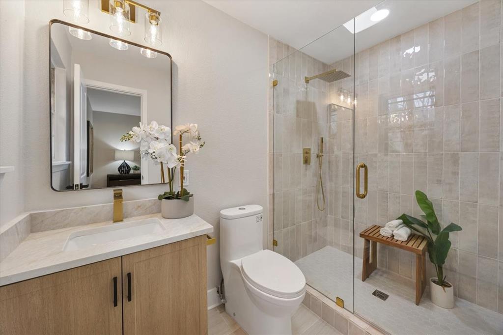 10524 Coleridge Street Dallas, TX 75218 - Photo 11 of 35 a bathroom with a sink toilet and shower