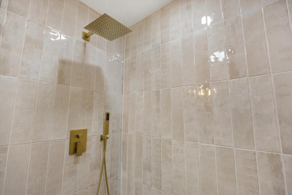 10524 Coleridge Street Dallas, TX 75218 - Photo 13 of 35 a bathroom with a shower