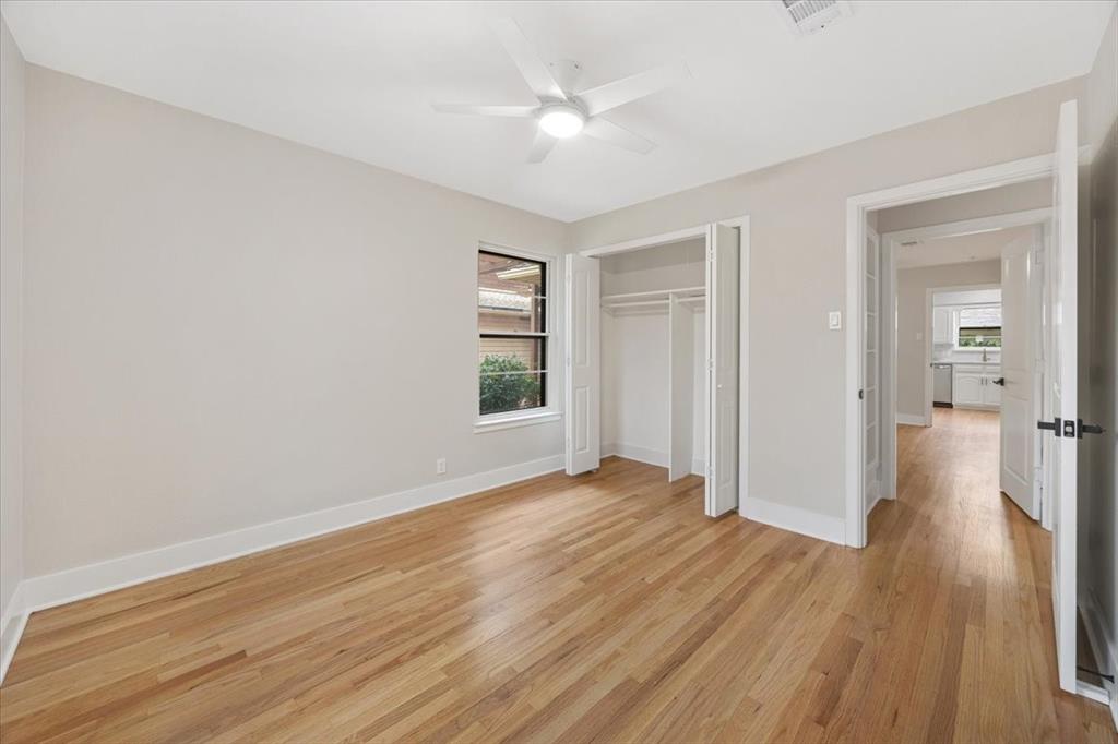 10524 Coleridge Street Dallas, TX 75218 - Photo 17 of 35 wooden floor in an empty room with a window