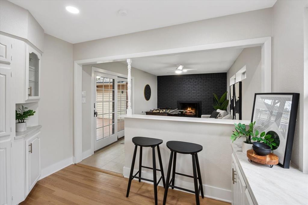 10524 Coleridge Street Dallas, TX 75218 - Photo 26 of 35 a living room with furniture and a flat screen tv
