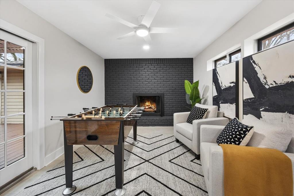10524 Coleridge Street Dallas, TX 75218 - Photo 28 of 35 a living room with furniture and a fireplace