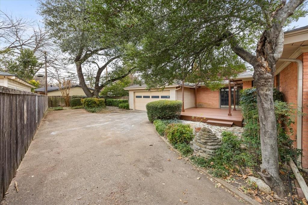 10524 Coleridge Street Dallas, TX 75218 - Photo 33 of 35 a front view of a house with garden